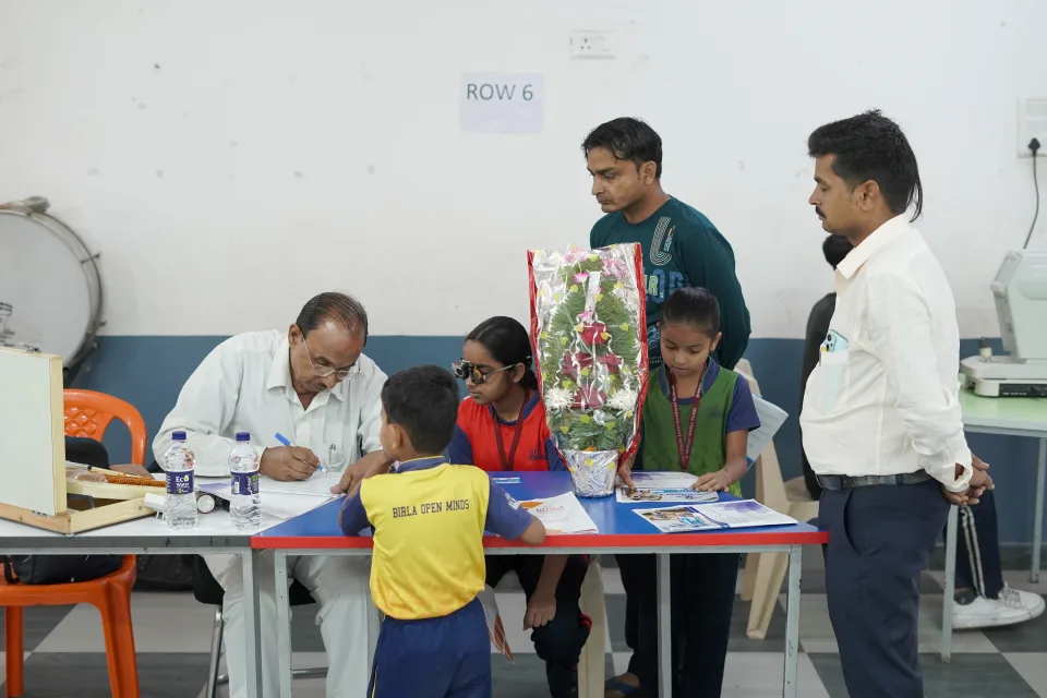 School community participating in the March 2026 medical camp at BOMIS Naubatpur