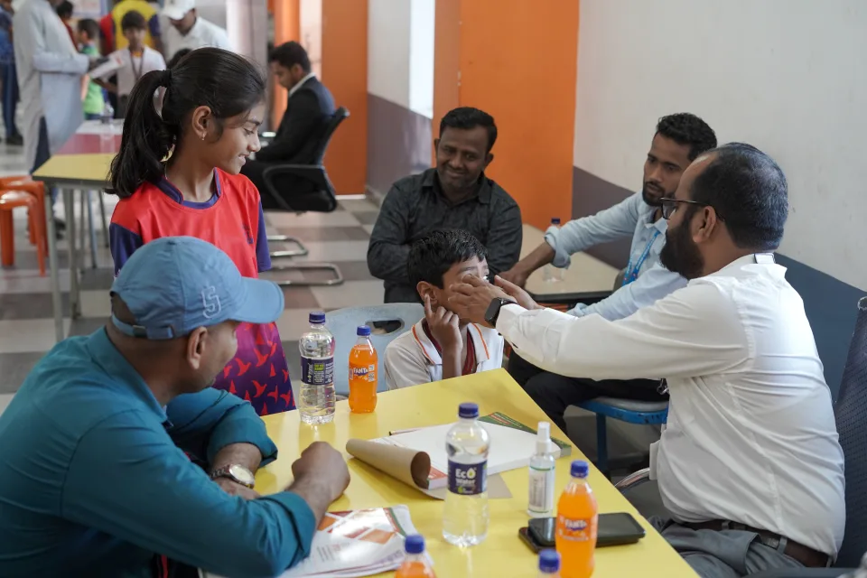 School community participating in the March 2026 medical camp at BOMIS Naubatpur