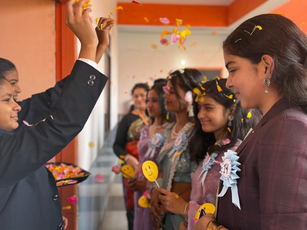 Students welcoming parents during a school celebration at BOMIS Naubatpur