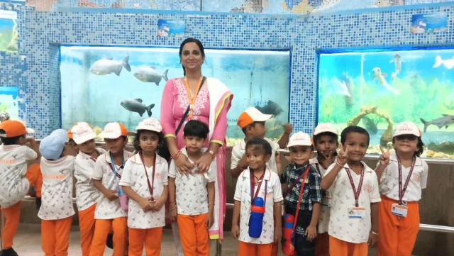 Early Years students visiting an aquarium with their teacher
